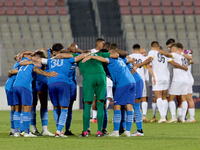 Soccer players from Zabbar St. Patrick and Marsaxlokk huddle prior to the Malta 360 Sports Premier League soccer match between Zabbar St. Pa...