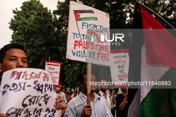 The Palestine Solidarity Committee, Bangladesh holds a rally and mass procession in front of the Raju Memorial Sculpture at TSC of Dhaka Uni...