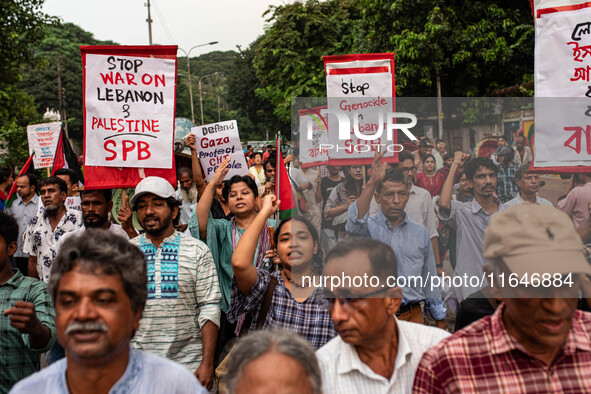 The Palestine Solidarity Committee, Bangladesh holds a rally and mass procession in front of the Raju Memorial Sculpture at TSC of Dhaka Uni...