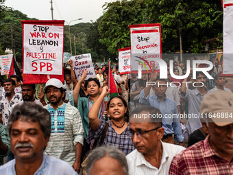 The Palestine Solidarity Committee, Bangladesh holds a rally and mass procession in front of the Raju Memorial Sculpture at TSC of Dhaka Uni...