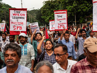 The Palestine Solidarity Committee, Bangladesh holds a rally and mass procession in front of the Raju Memorial Sculpture at TSC of Dhaka Uni...