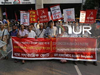 Activists of the Left Democratic Alliance Bangladesh take part in a protest demanding an end to the war in Lebanon and Palestine in Dhaka, B...