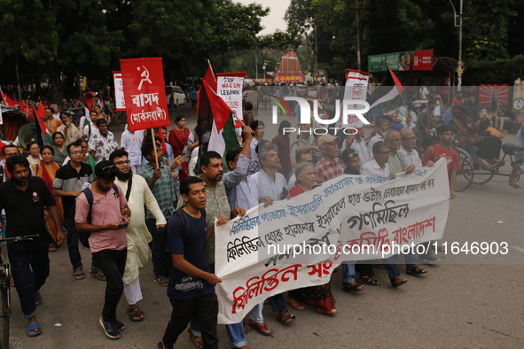 Activists of the Palestine Solidarity Committee, Bangladesh, participate in a protest demanding an end to the war in Lebanon and Palestine i...