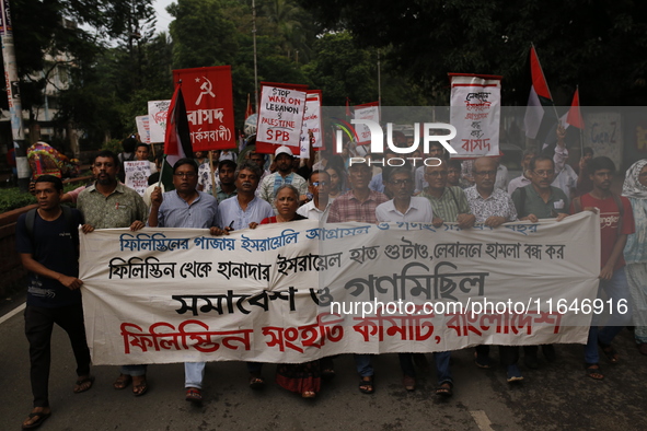 Activists of the Palestine Solidarity Committee, Bangladesh, participate in a protest demanding an end to the war in Lebanon and Palestine i...