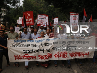 Activists of the Palestine Solidarity Committee, Bangladesh, participate in a protest demanding an end to the war in Lebanon and Palestine i...