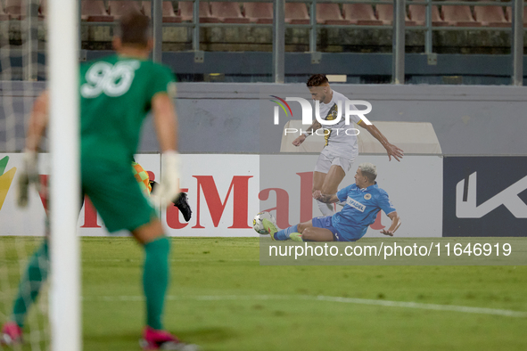 In Ta' Qali, Malta, on October 2, 2024, Diogo Joao Regala De Figueiredo Tavares (back) is challenged by Yuri De Jesus Messias (front) of Mar...