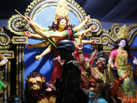 A member of the Bangladesh Army patrols at a temple ahead of the Durga Puja festival, the largest festival of the Hindu community, in Dhaka,...