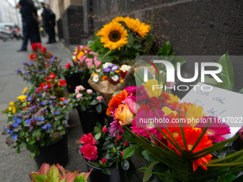 The candlelight and flowers are seen in front of the Roonstrasse Synagogue in Cologne, Germany, on October 7, 2024. (