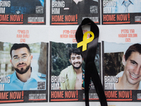 Pictures of kidnapped Israelis are seen in front of the Roonstrasse Synagogue in Cologne, Germany, on October 7, 2024. (