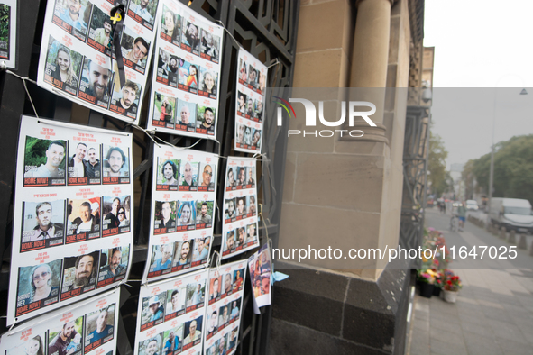 Pictures of kidnapped Israelis are seen in front of the Roonstrasse Synagogue in Cologne, Germany, on October 7, 2024. 