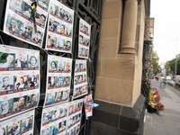 Pictures of kidnapped Israelis are seen in front of the Roonstrasse Synagogue in Cologne, Germany, on October 7, 2024. (