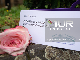 The candlelight and flowers are seen in front of the Roonstrasse Synagogue in Cologne, Germany, on October 7, 2024. (