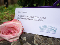 The candlelight and flowers are seen in front of the Roonstrasse Synagogue in Cologne, Germany, on October 7, 2024. (