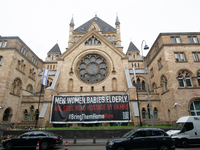 The large banner of ''bringthemhomenow'' hangs on the Roonstrasse Synagogue in Cologne, Germany, on October 7, 2024. (