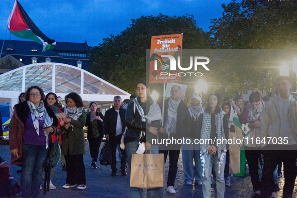 A dozen people gather to mark the first anniversary of Israel's attack on Gaza in Bonn, Germany, on October 7, 2024. 