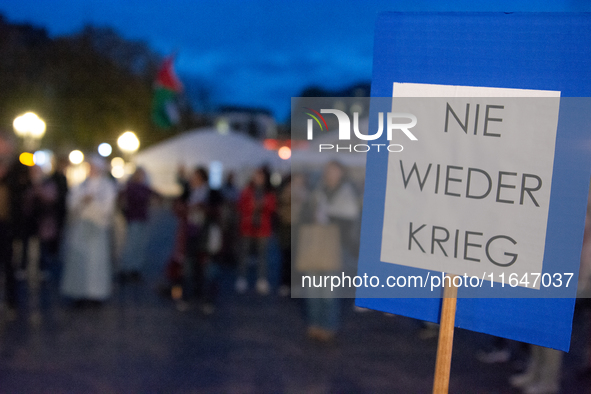 A dozen people gather to mark the first anniversary of Israel's attack on Gaza in Bonn, Germany, on October 7, 2024. 