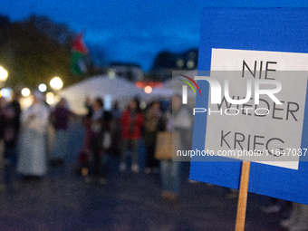 A dozen people gather to mark the first anniversary of Israel's attack on Gaza in Bonn, Germany, on October 7, 2024. (