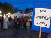 A dozen people gather to mark the first anniversary of Israel's attack on Gaza in Bonn, Germany, on October 7, 2024. (