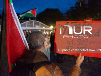 A dozen people gather to mark the first anniversary of Israel's attack on Gaza in Bonn, Germany, on October 7, 2024. (