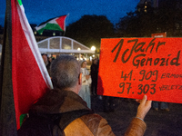 A dozen people gather to mark the first anniversary of Israel's attack on Gaza in Bonn, Germany, on October 7, 2024. (