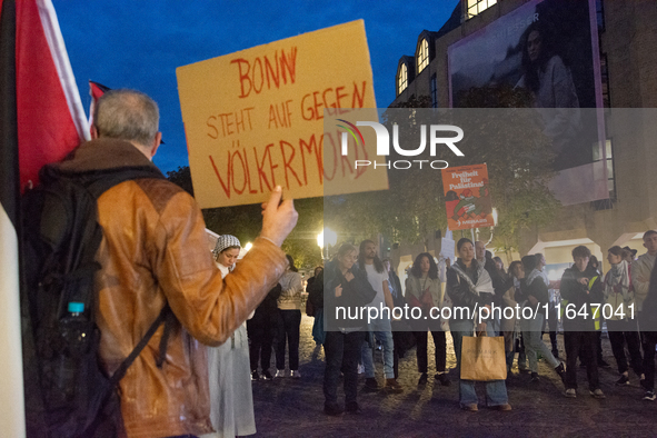 A dozen people gather to mark the first anniversary of Israel's attack on Gaza in Bonn, Germany, on October 7, 2024. 