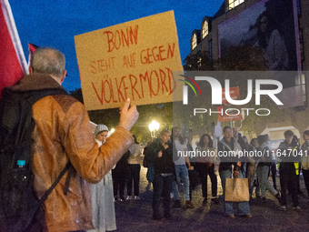 A dozen people gather to mark the first anniversary of Israel's attack on Gaza in Bonn, Germany, on October 7, 2024. (