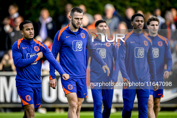 Netherlands players Justin Kluivert, Stefan de Vrij, and Jorrel Hato participate in the training and press conference for the Netherlands Na...