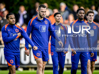 Netherlands players Justin Kluivert, Stefan de Vrij, and Jorrel Hato participate in the training and press conference for the Netherlands Na...