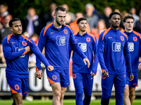 Netherlands players Justin Kluivert, Stefan de Vrij, and Jorrel Hato participate in the training and press conference for the Netherlands Na...