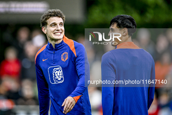 Netherlands players Guus Til and Tijjani Reijnders participate in the training and press conference for the Netherlands Nations League seaso...