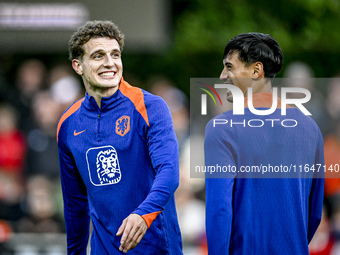 Netherlands players Guus Til and Tijjani Reijnders participate in the training and press conference for the Netherlands Nations League seaso...