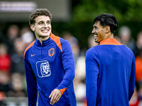 Netherlands players Guus Til and Tijjani Reijnders participate in the training and press conference for the Netherlands Nations League seaso...