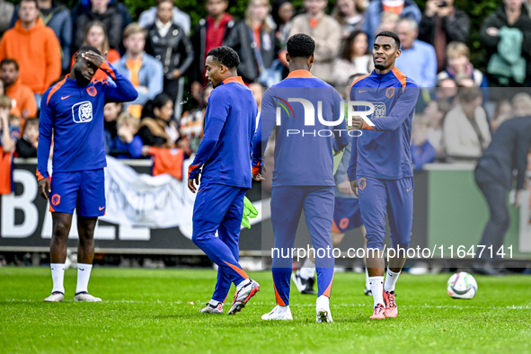 Netherlands players Lutsharel Geertruida, Quinten Timber, and Ryan Gravenberch participate in the training and press conference for the Neth...