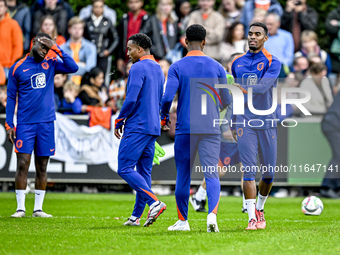 Netherlands players Lutsharel Geertruida, Quinten Timber, and Ryan Gravenberch participate in the training and press conference for the Neth...