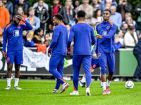 Netherlands players Lutsharel Geertruida, Quinten Timber, and Ryan Gravenberch participate in the training and press conference for the Neth...