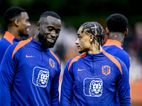 Netherlands players Lutsharel Geertruida and Xavi Simons participate in the training and press conference for the Netherlands Nations League...