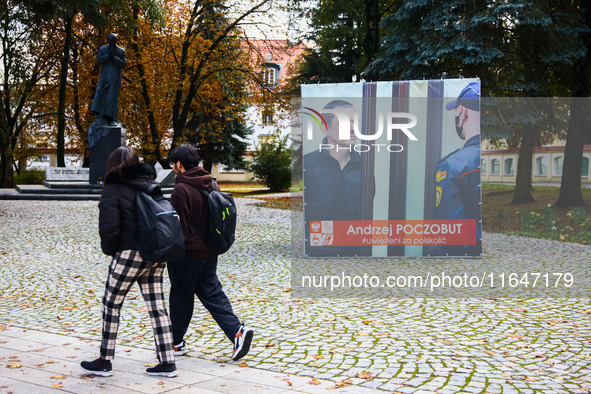 A banner with pictures of Belarusian-Polish journalist, Andrzej Poczobut, a political prisoner of Alexander Lukashenko regime, is seen in th...