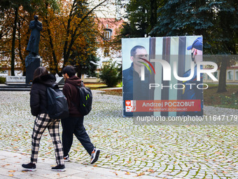 A banner with pictures of Belarusian-Polish journalist, Andrzej Poczobut, a political prisoner of Alexander Lukashenko regime, is seen in th...