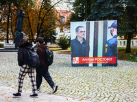 A banner with pictures of Belarusian-Polish journalist, Andrzej Poczobut, a political prisoner of Alexander Lukashenko regime, is seen in th...