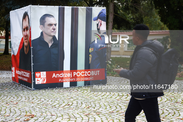 A banner with pictures of Belarusian-Polish journalist, Andrzej Poczobut, a political prisoner of Alexander Lukashenko regime, is seen in th...