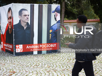 A banner with pictures of Belarusian-Polish journalist, Andrzej Poczobut, a political prisoner of Alexander Lukashenko regime, is seen in th...