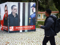 A banner with pictures of Belarusian-Polish journalist, Andrzej Poczobut, a political prisoner of Alexander Lukashenko regime, is seen in th...