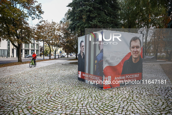 A banner with pictures of Belarusian-Polish journalist, Andrzej Poczobut, a political prisoner of Alexander Lukashenko regime, is seen in th...