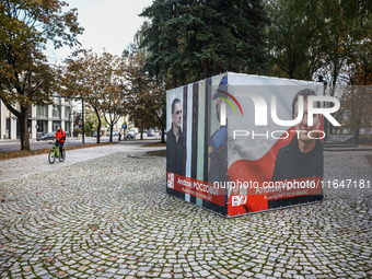 A banner with pictures of Belarusian-Polish journalist, Andrzej Poczobut, a political prisoner of Alexander Lukashenko regime, is seen in th...