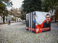 A banner with pictures of Belarusian-Polish journalist, Andrzej Poczobut, a political prisoner of Alexander Lukashenko regime, is seen in th...