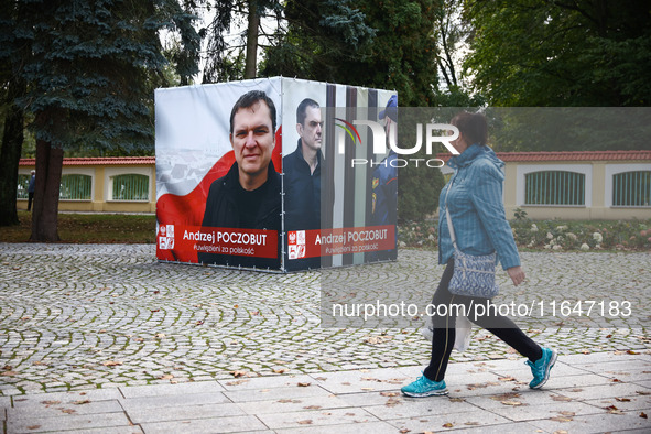 A banner with pictures of Belarusian-Polish journalist, Andrzej Poczobut, a political prisoner of Alexander Lukashenko regime, is seen in th...