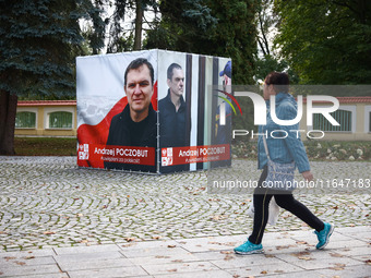 A banner with pictures of Belarusian-Polish journalist, Andrzej Poczobut, a political prisoner of Alexander Lukashenko regime, is seen in th...