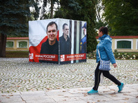 A banner with pictures of Belarusian-Polish journalist, Andrzej Poczobut, a political prisoner of Alexander Lukashenko regime, is seen in th...