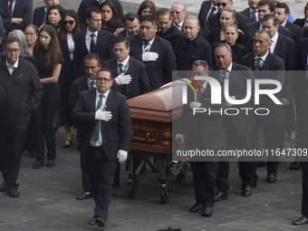 Funeral home staff carry the coffin of Ifigenia Martinez, President of the Chamber of Deputies, in Mexico City, Mexico, on October 7, 2024....