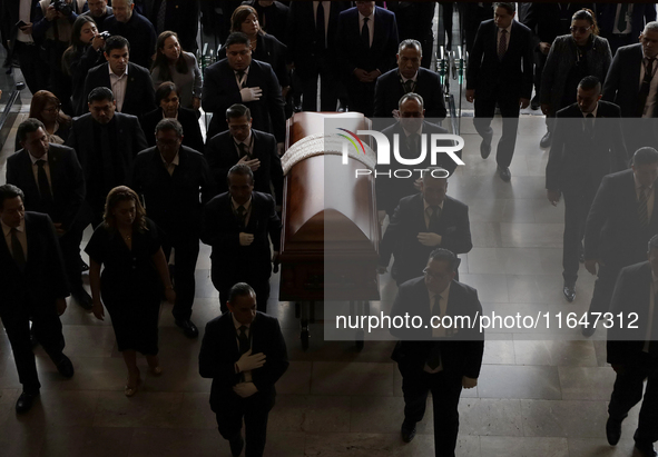 Funeral home staff carry the coffin of Ifigenia Martinez, President of the Chamber of Deputies, in Mexico City, Mexico, on October 7, 2024....